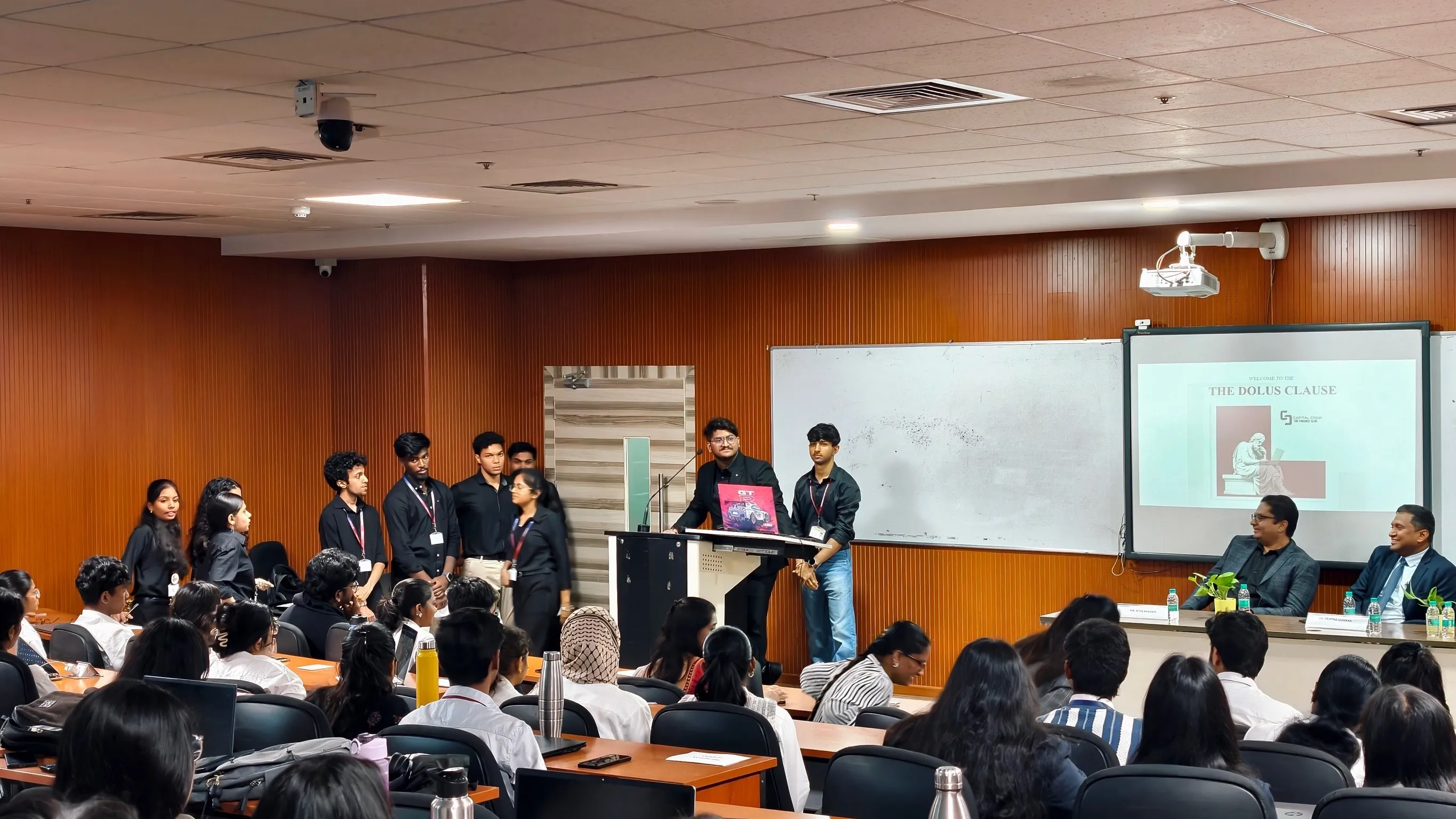 Students presenting their work to an audience and evaluation panel